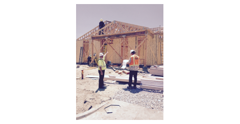 Two men working at a construction site