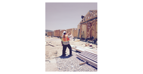 Two men working at a construction site