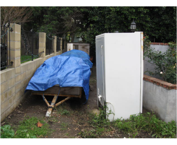 Discarded Appliances & Lawn Parking